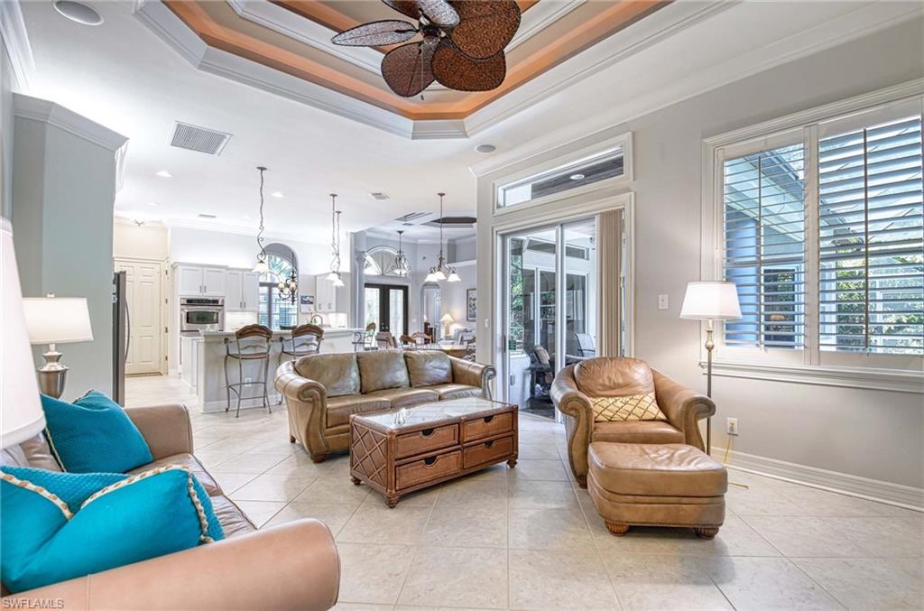 3002 Crayton Road Naples, FL 34103 - Photo 11 of 27 a living room with furniture and a large window