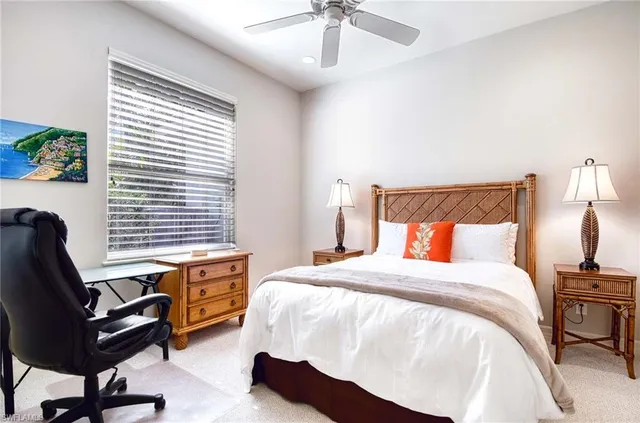 a bed room with a bed and a chair