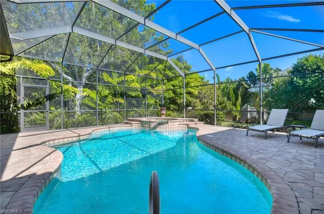 a view of a backyard with swimming pool
