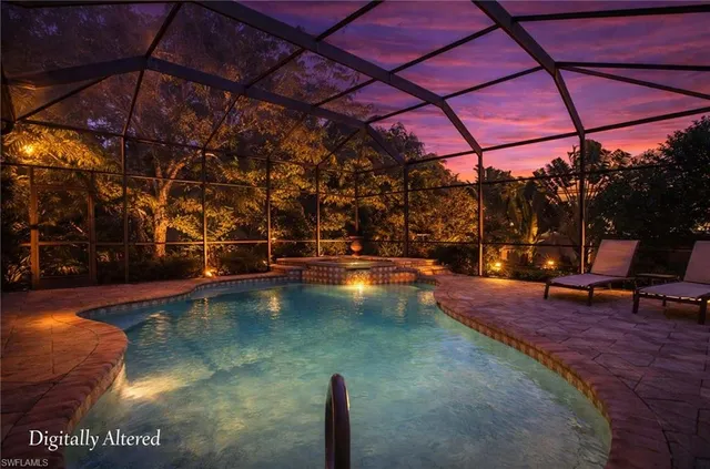 a view of a swimming pool with a patio