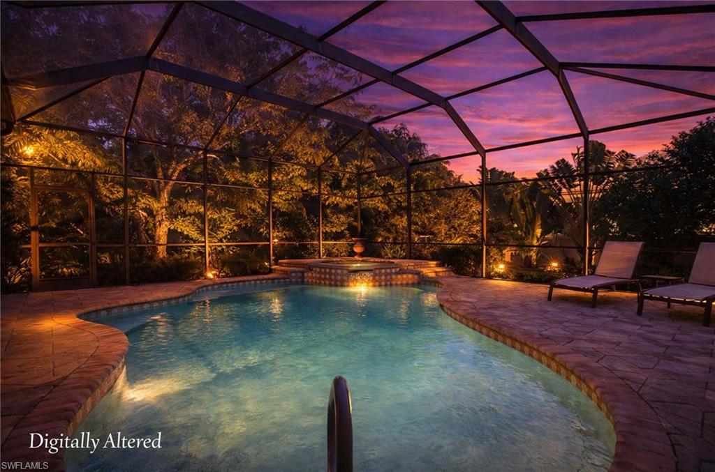 3002 Crayton Road Naples, FL 34103 - Photo 21 of 27 a view of a swimming pool with a patio