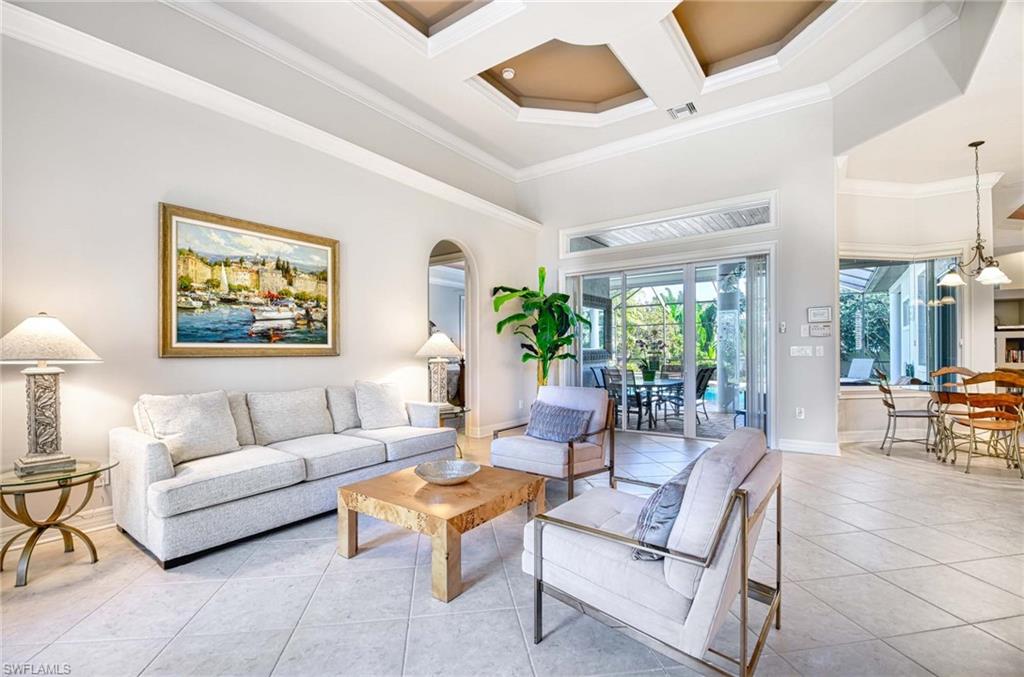 3002 Crayton Road Naples, FL 34103 - Photo 4 of 27 a living room with furniture and a large window
