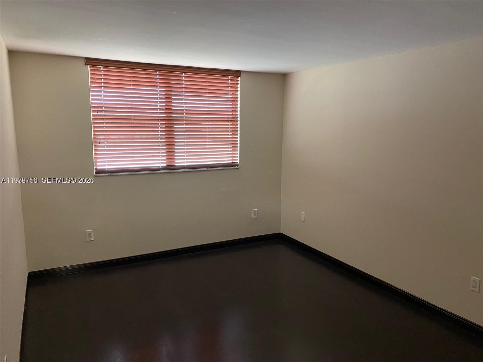 8002 Southwest 149th Avenue, Unit B409 Miami, FL 33193 - Photo 11 of 15 an empty room with a window