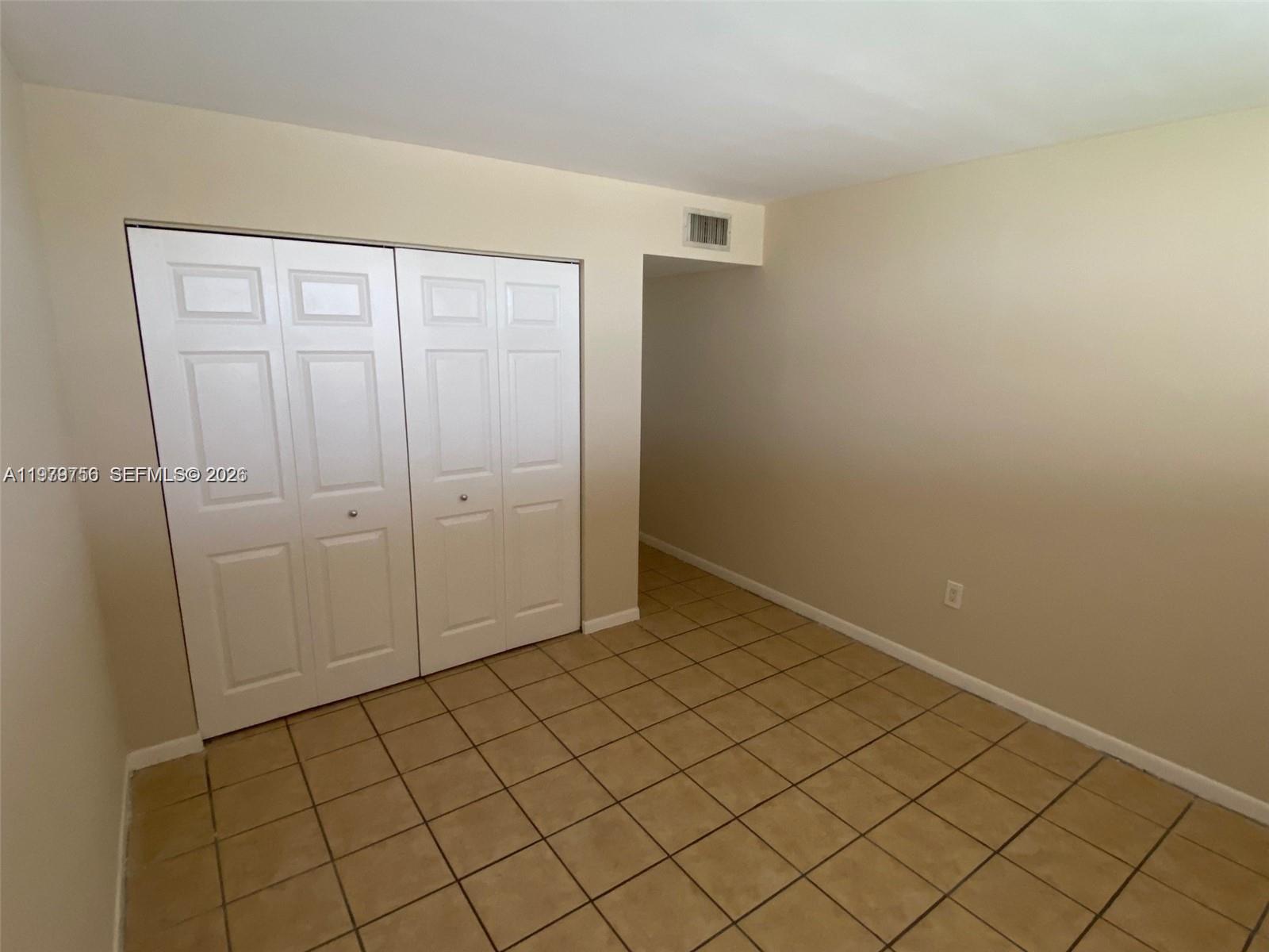 8002 Southwest 149th Avenue, Unit B409 Miami, FL 33193 - Photo 12 of 23 a view of an empty room