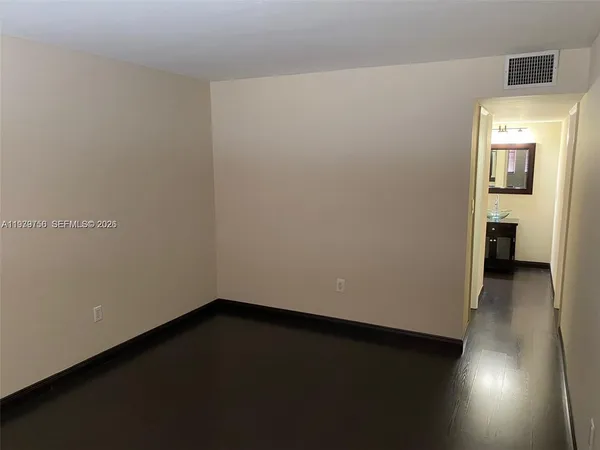 an empty room with a bench