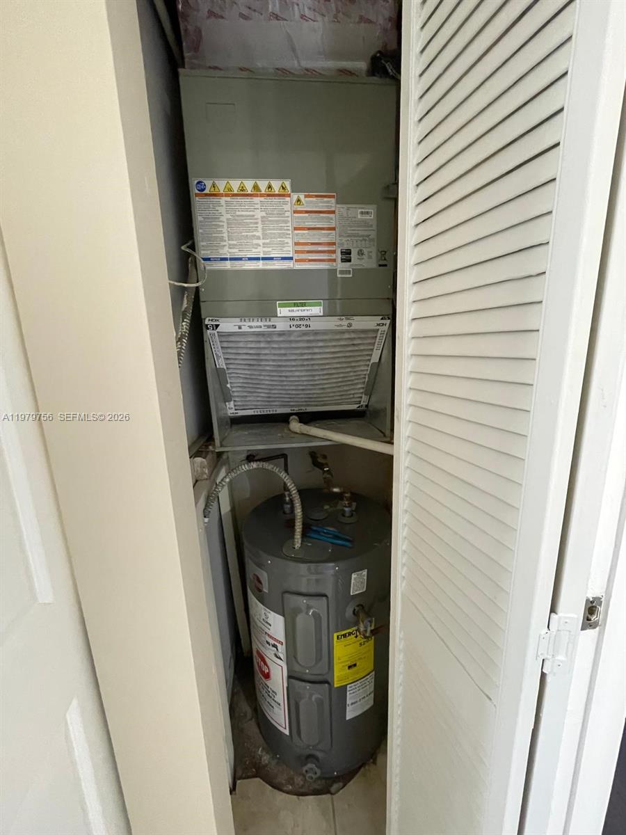8002 Southwest 149th Avenue, Unit B409 Miami, FL 33193 - Photo 16 of 23 a utility room with washer and dryer