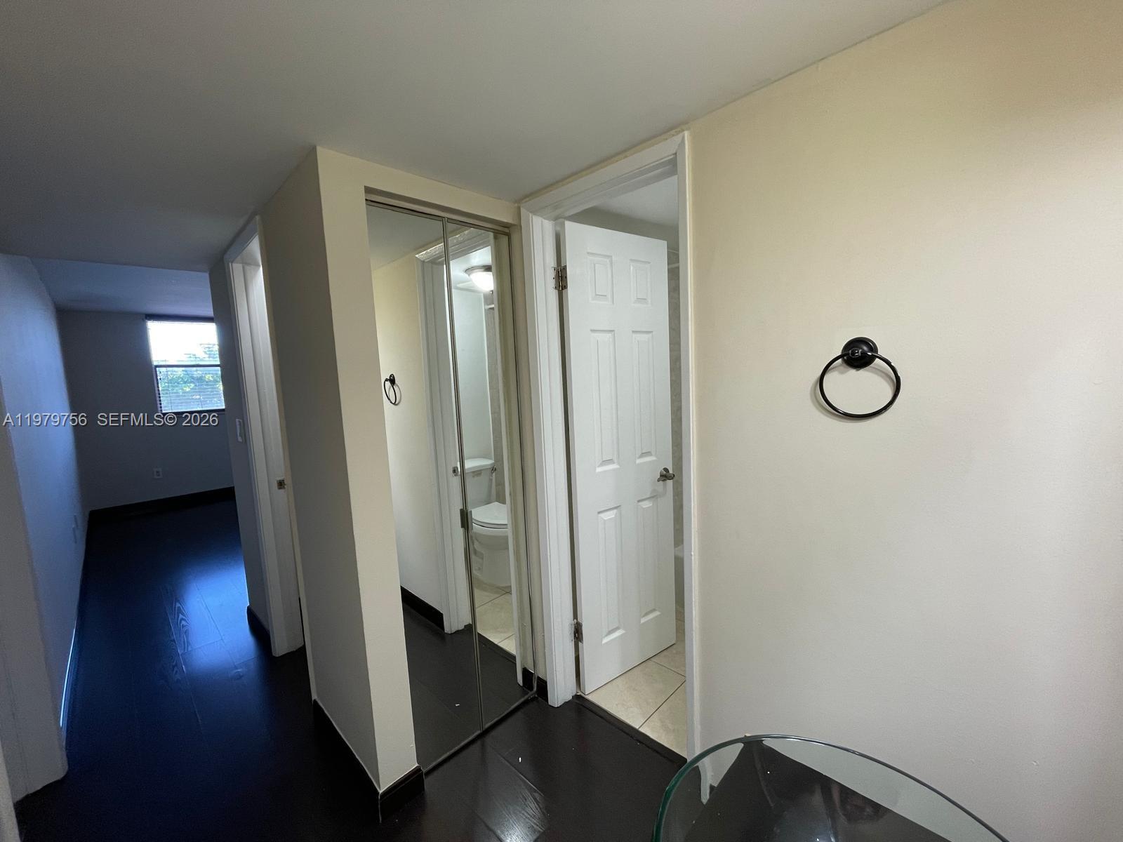 8002 Southwest 149th Avenue, Unit B409 Miami, FL 33193 - Photo 20 of 23 a view of a hallway with wooden floor