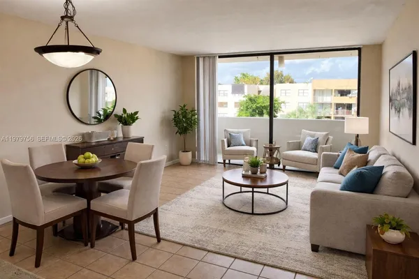 a living room with furniture a window and a potted plant