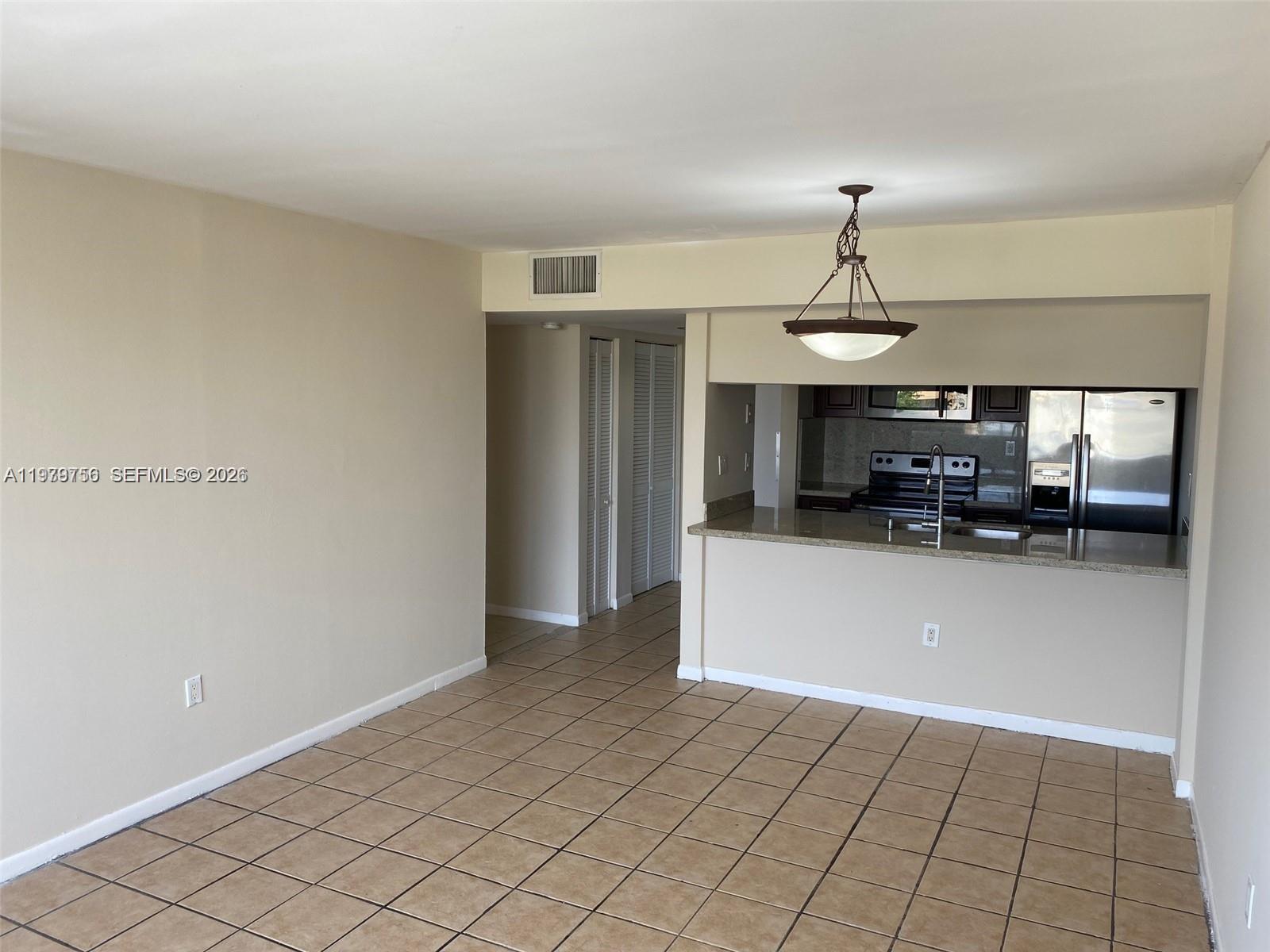 8002 Southwest 149th Avenue, Unit B409 Miami, FL 33193 - Photo 6 of 15 a view of a livingroom with furniture and window