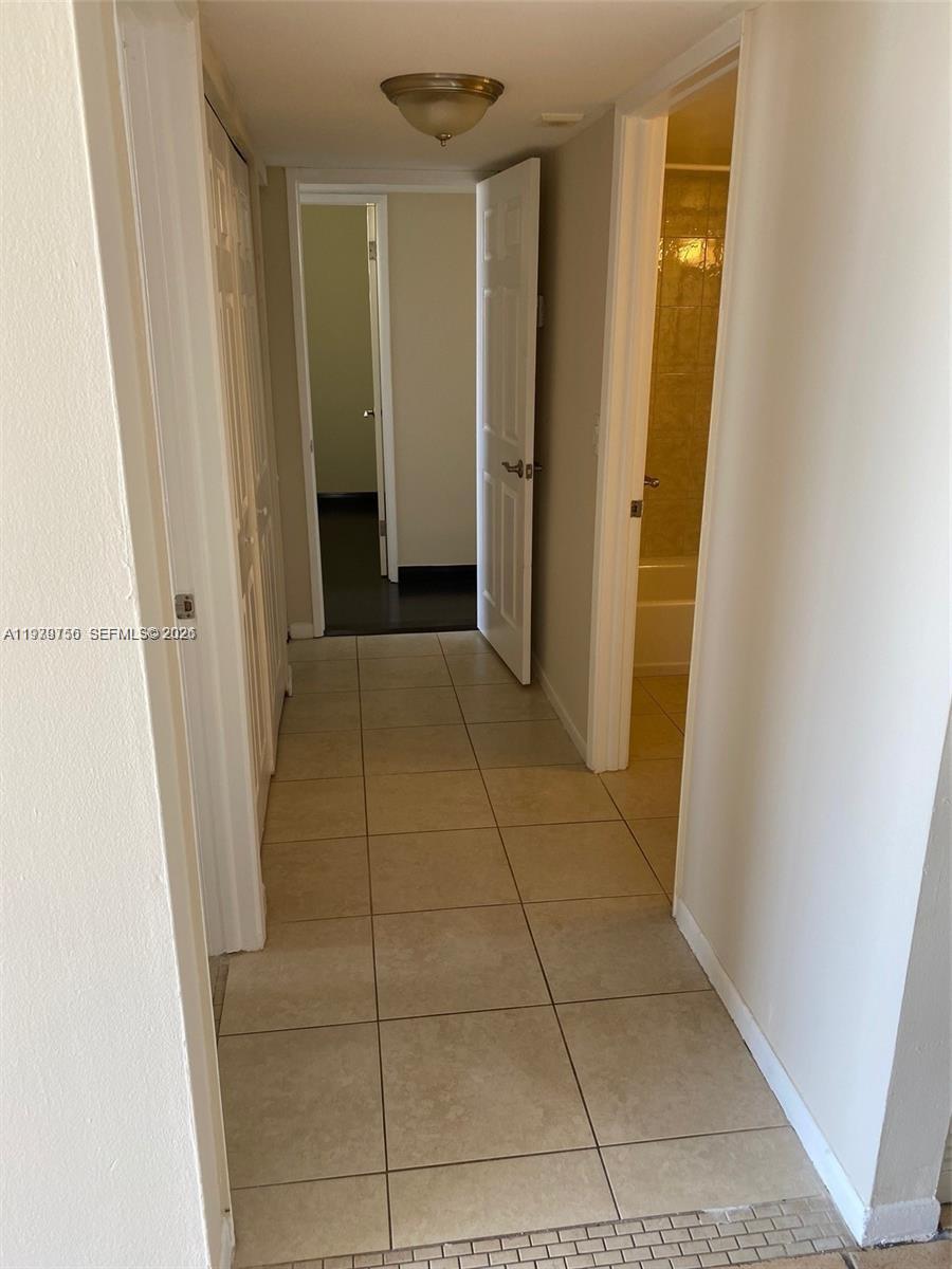 8002 Southwest 149th Avenue, Unit B409 Miami, FL 33193 - Photo 10 of 23 a view of hallway with shower