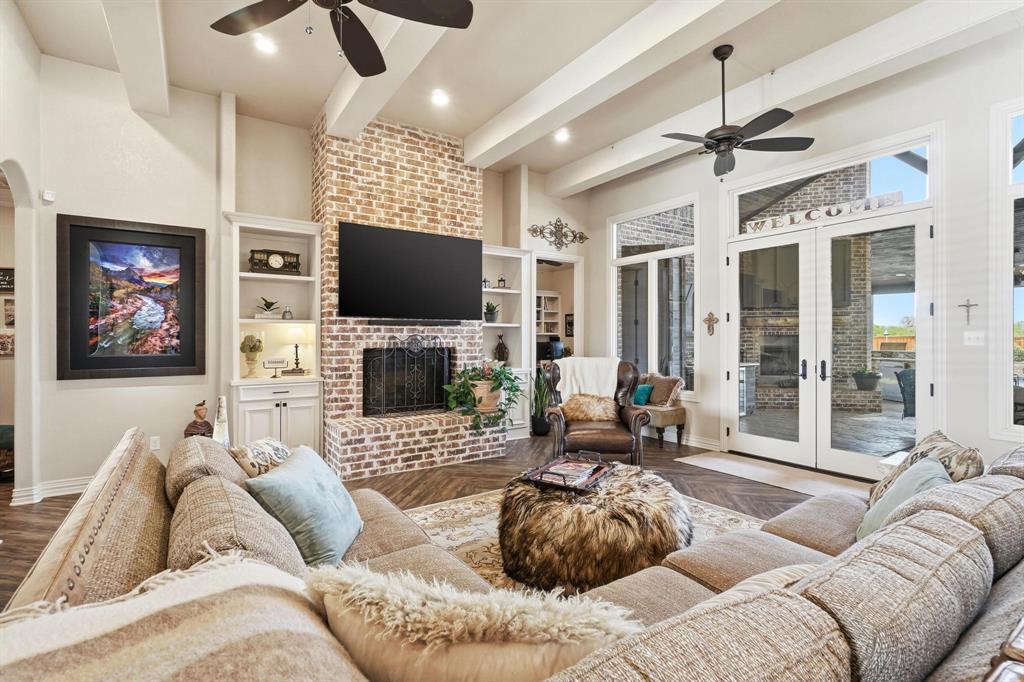 249 Rising Star Drive Abilene, TX 79606 - Photo 5 of 40 a living room with furniture a large window and a flat screen tv