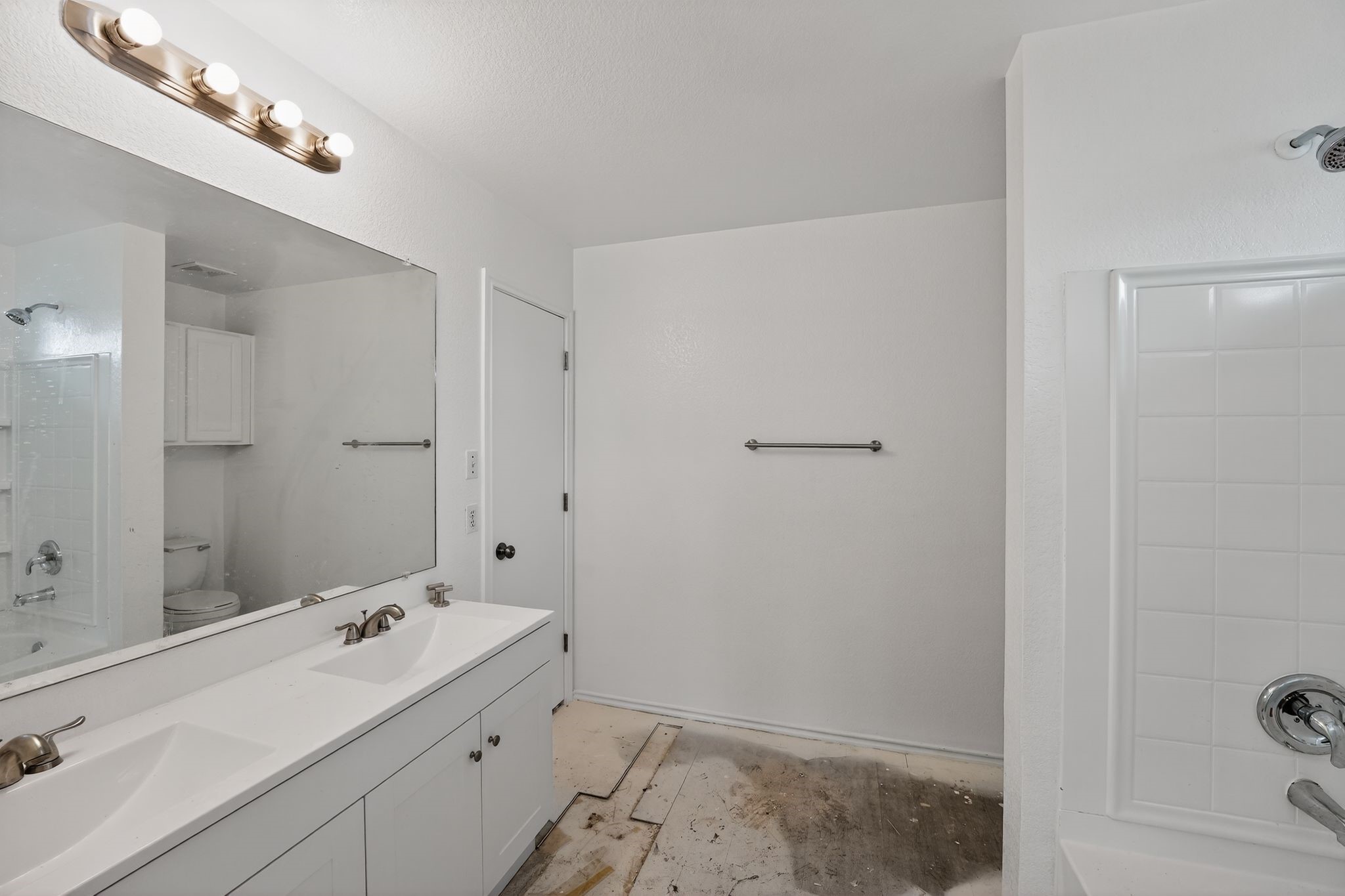 13505 Sierra Wind Lane Elgin, TX 78621 - Photo 13 of 18 a bathroom with a sink a shower and a mirror