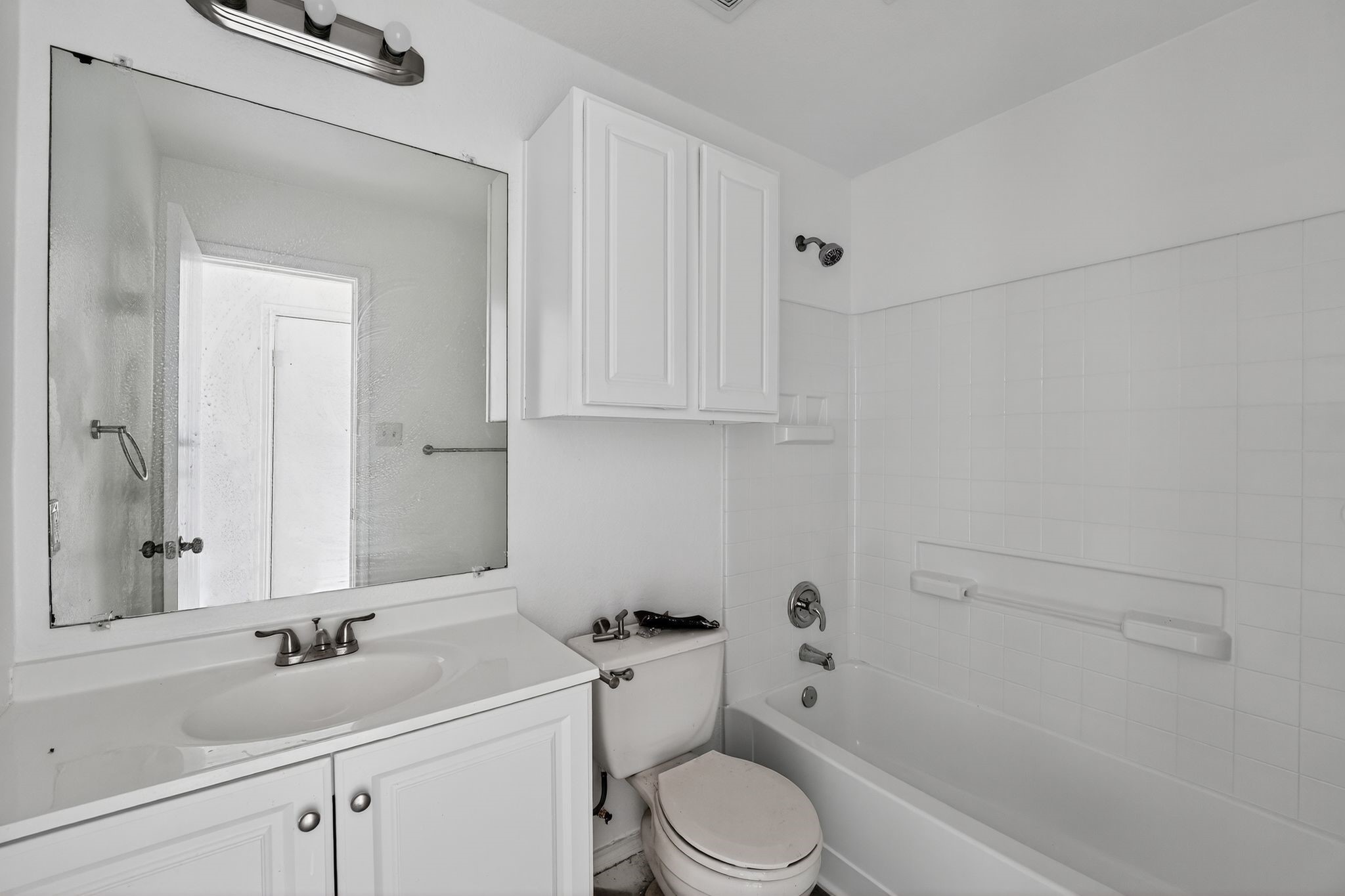 13505 Sierra Wind Lane Elgin, TX 78621 - Photo 14 of 18 a bathroom with a sink a toilet and shower