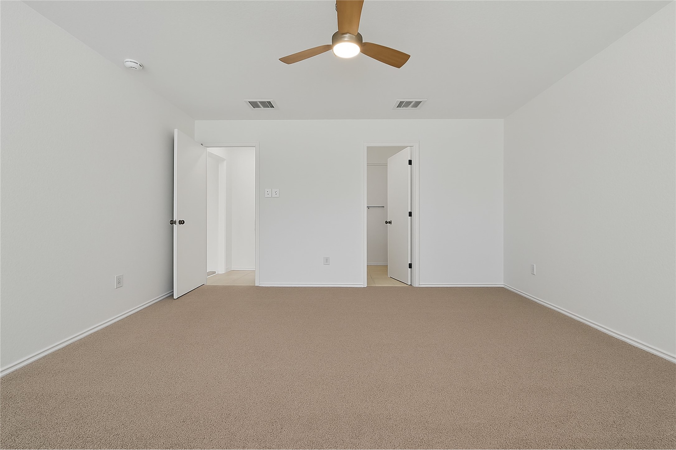 13505 Sierra Wind Lane Elgin, TX 78621 - Photo 15 of 18 an empty room with a chandelier fan