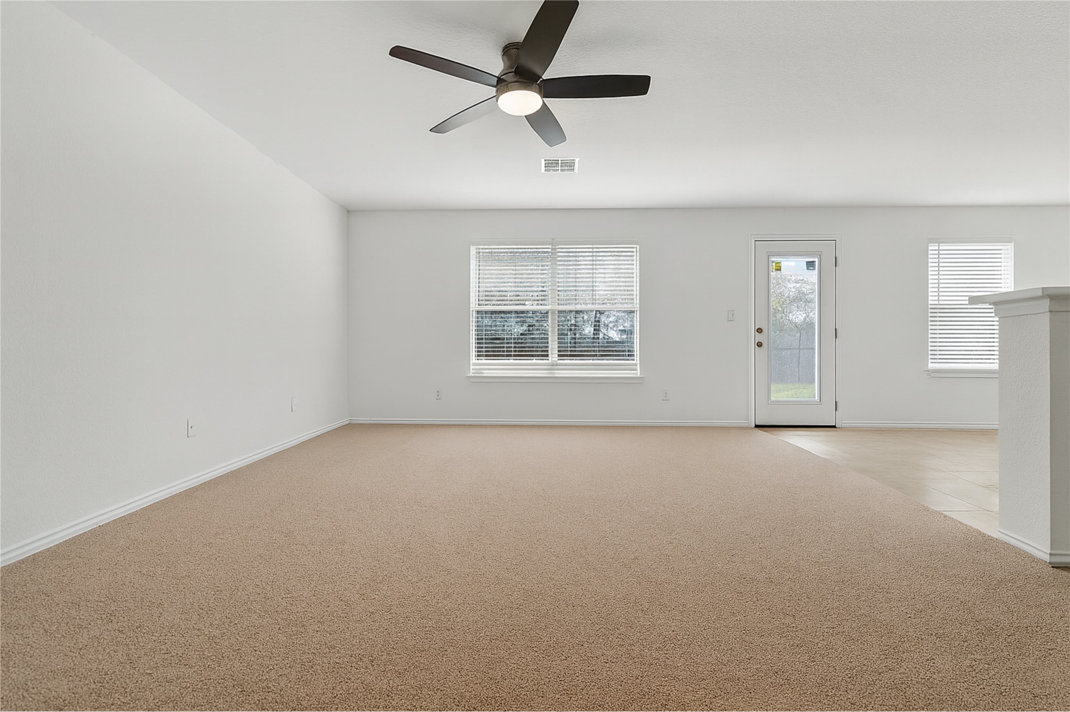 13505 Sierra Wind Lane Elgin, TX 78621 - Photo 16 of 18 an empty room with a empty space and windows