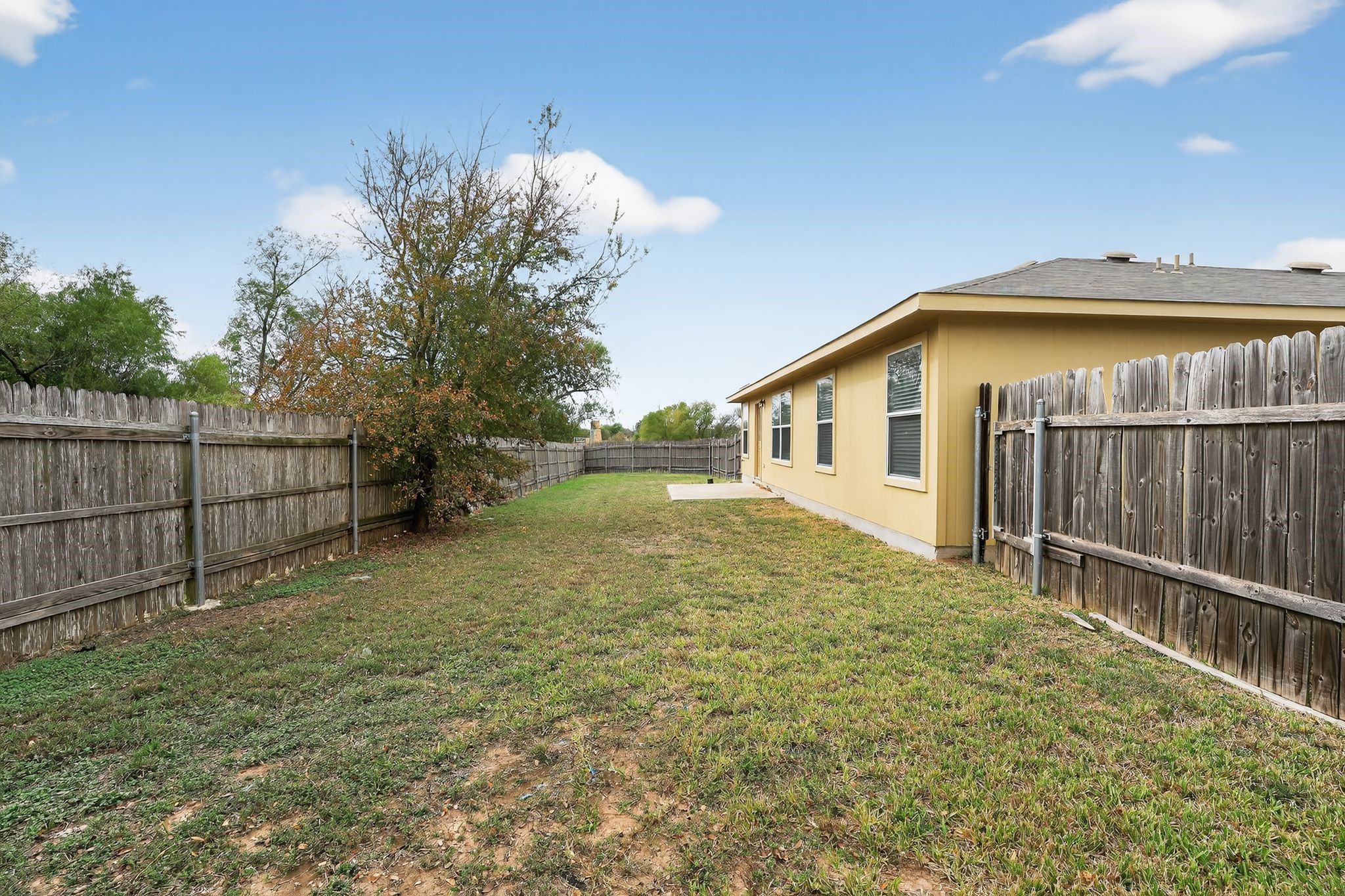 13505 Sierra Wind Lane Elgin, TX 78621 - Photo 3 of 18 a bathroom with a sink and mirror