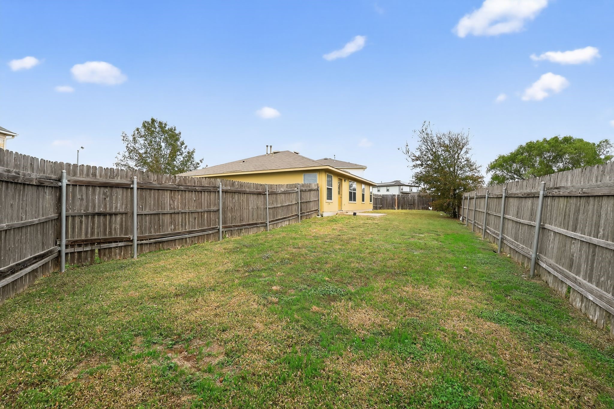 13505 Sierra Wind Lane Elgin, TX 78621 - Photo 4 of 18 a view of a backyard