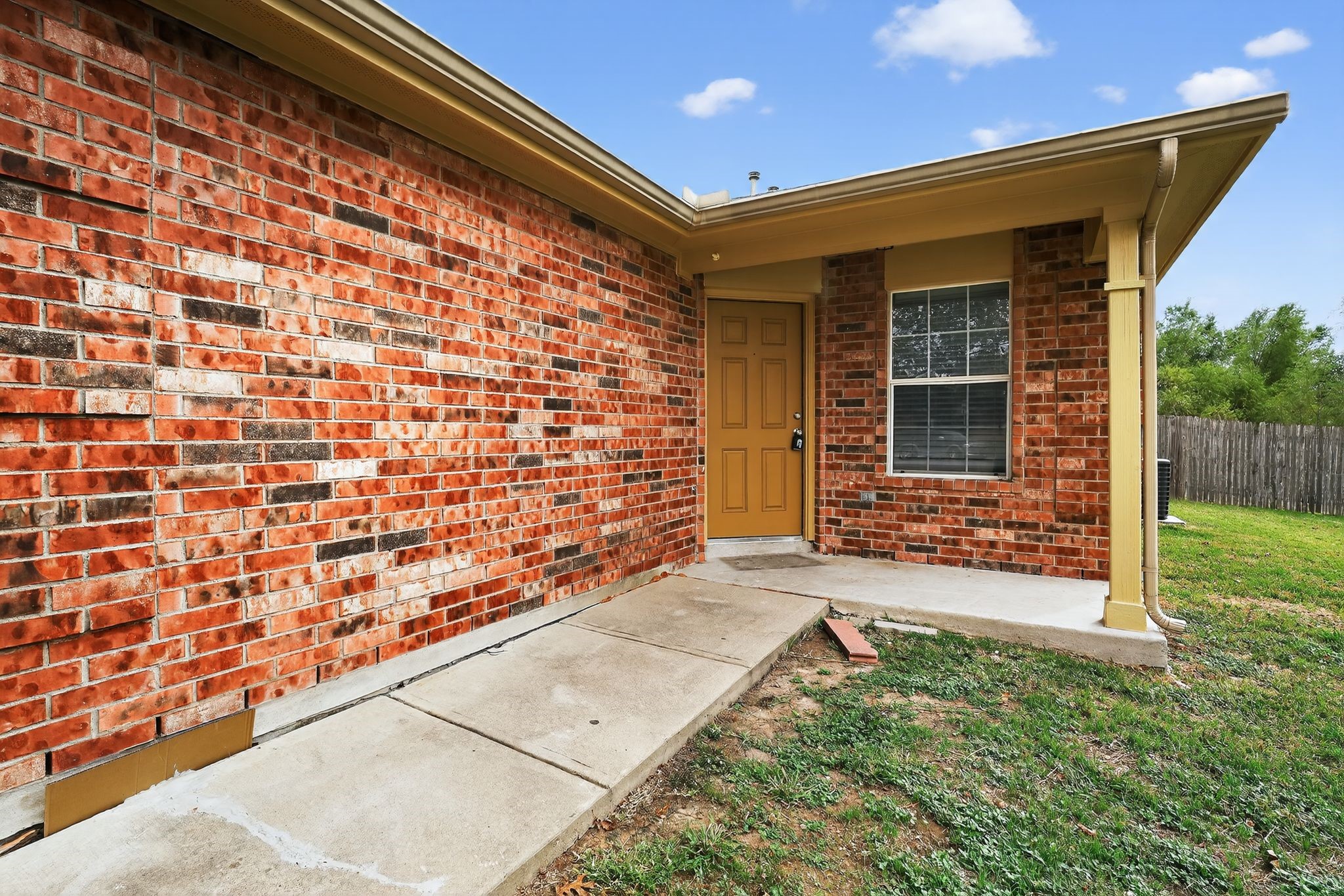 13505 Sierra Wind Lane Elgin, TX 78621 - Photo 5 of 18 front view of a house with a large window