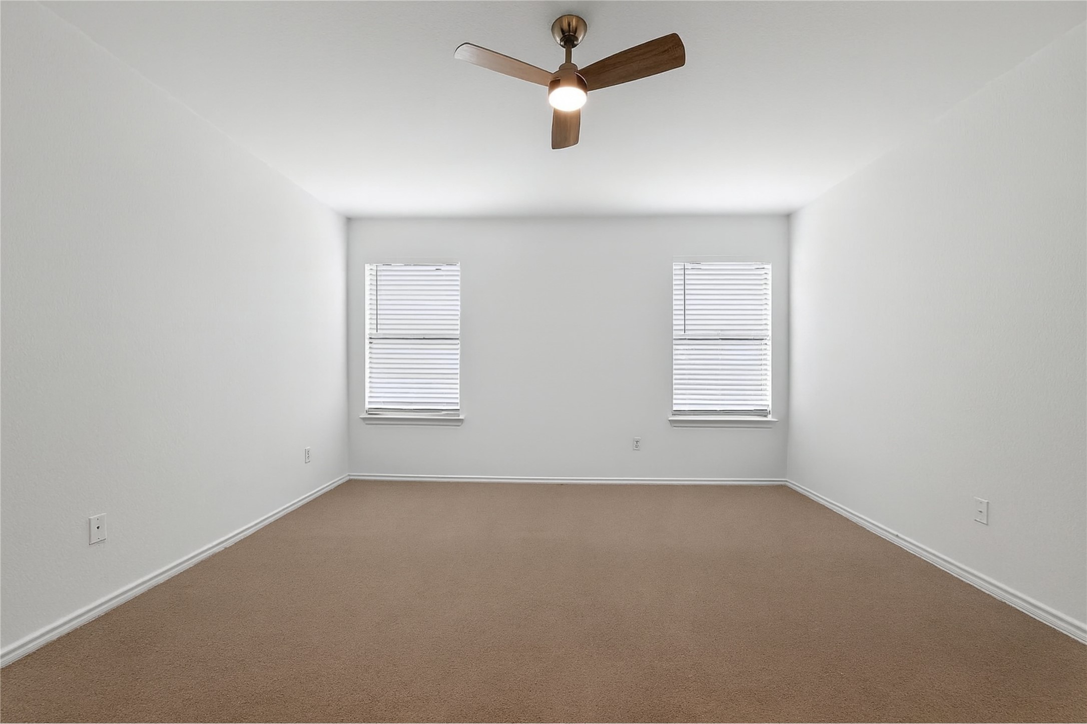 13505 Sierra Wind Lane Elgin, TX 78621 - Photo 10 of 18 an empty room with a window and ceiling fan