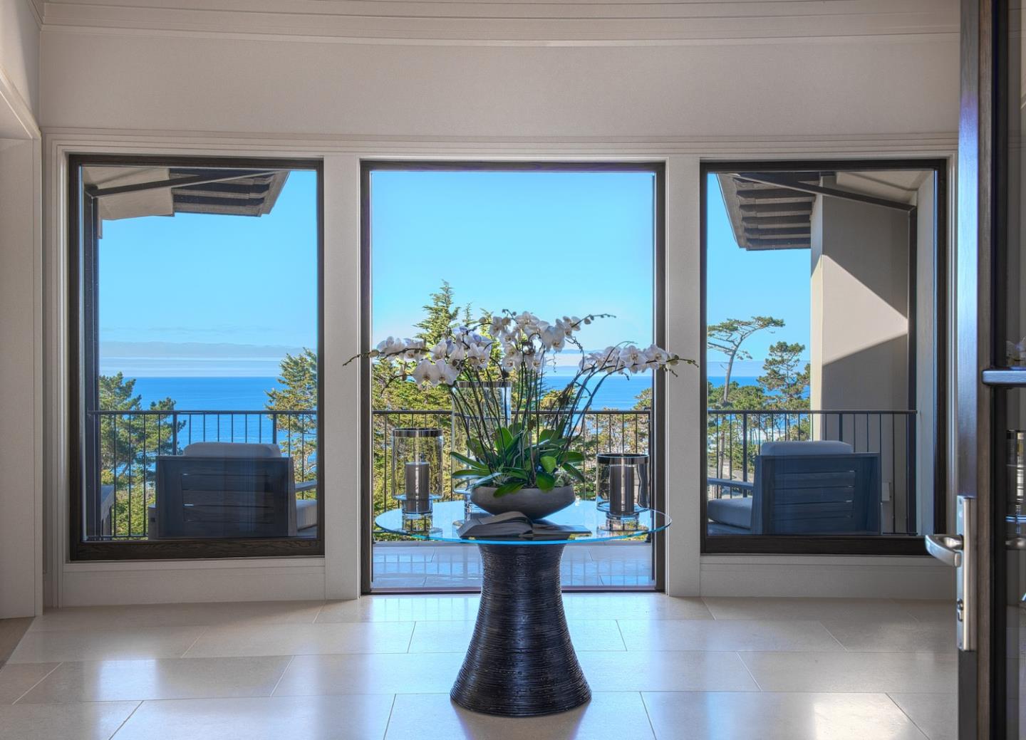 1231 Padre Lane Pebble Beach, CA 93953 - Photo 3 of 41 a view of a glass door with a potted plant on a table