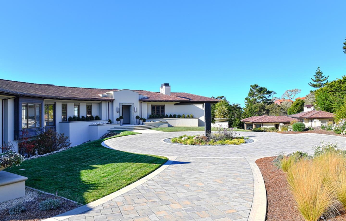 1231 Padre Lane Pebble Beach, CA 93953 - Photo 35 of 41 a front view of a house with a yard table and chairs