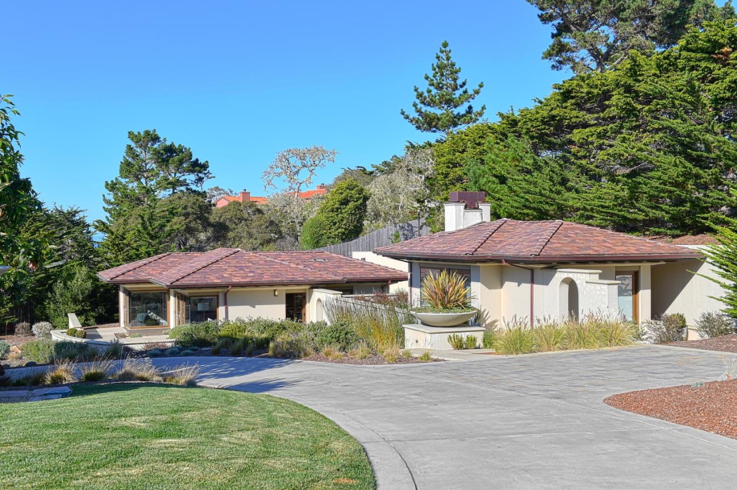 1231 Padre Lane Pebble Beach, CA 93953 - Photo 36 of 41 a front view of a house with a garden