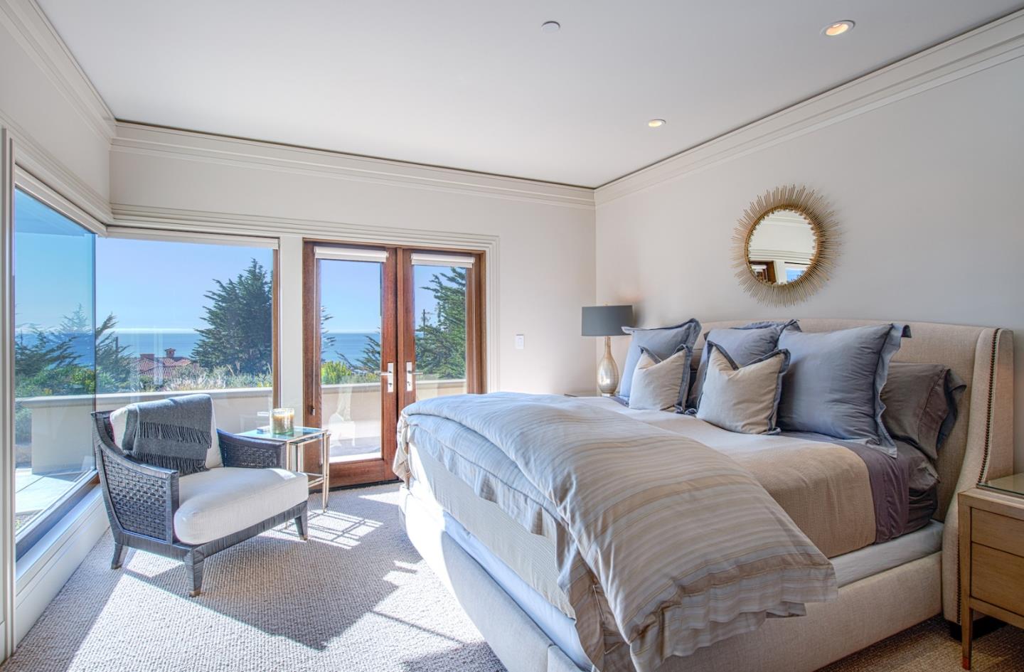 1231 Padre Lane Pebble Beach, CA 93953 - Photo 39 of 41 a large bedroom with bed and glass windows