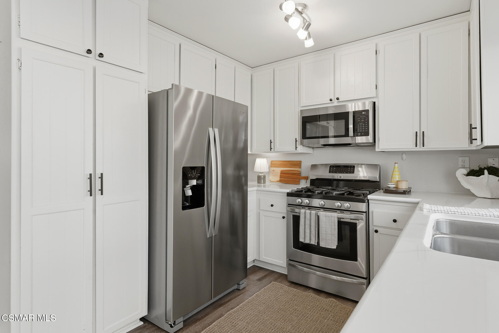 1860 Wychoff Avenue Simi Valley, CA 93063 - Photo 17 of 47 a kitchen with stainless steel appliances white cabinets and a stove