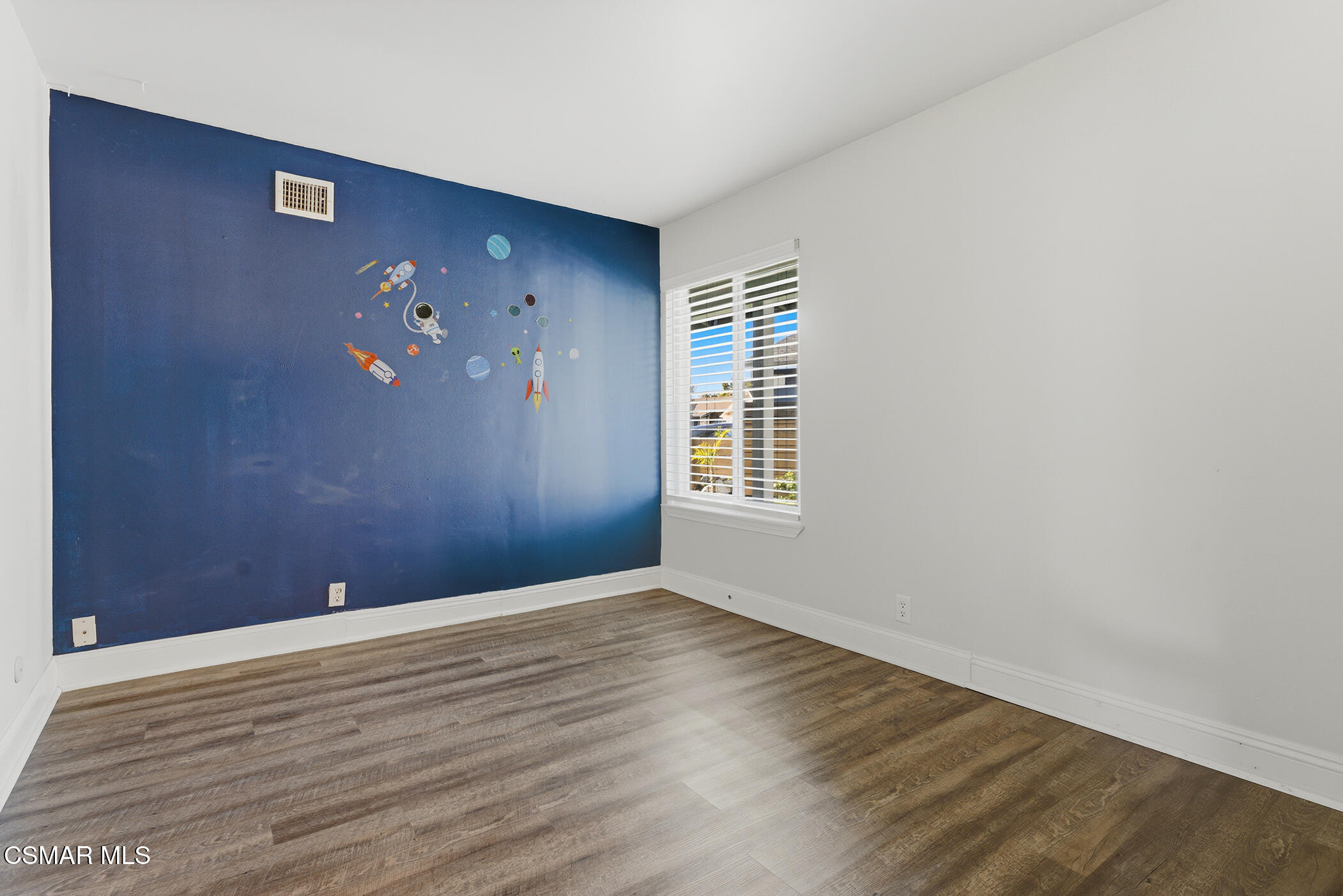 1860 Wychoff Avenue Simi Valley, CA 93063 - Photo 24 of 47 a view of an empty room with wooden floor and a window