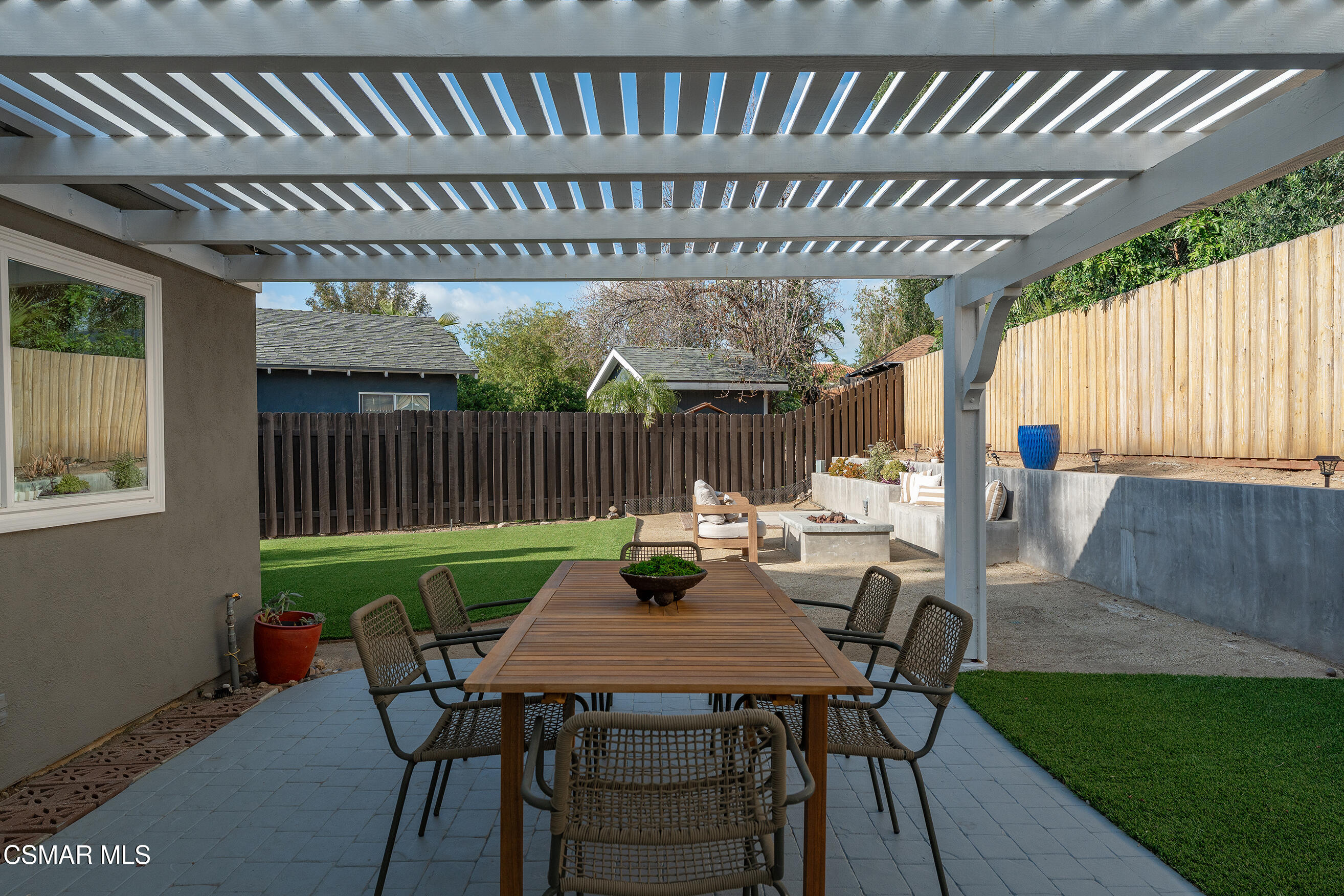 1860 Wychoff Avenue Simi Valley, CA 93063 - Photo 31 of 47 a view of a table and chairs in back yard of a house