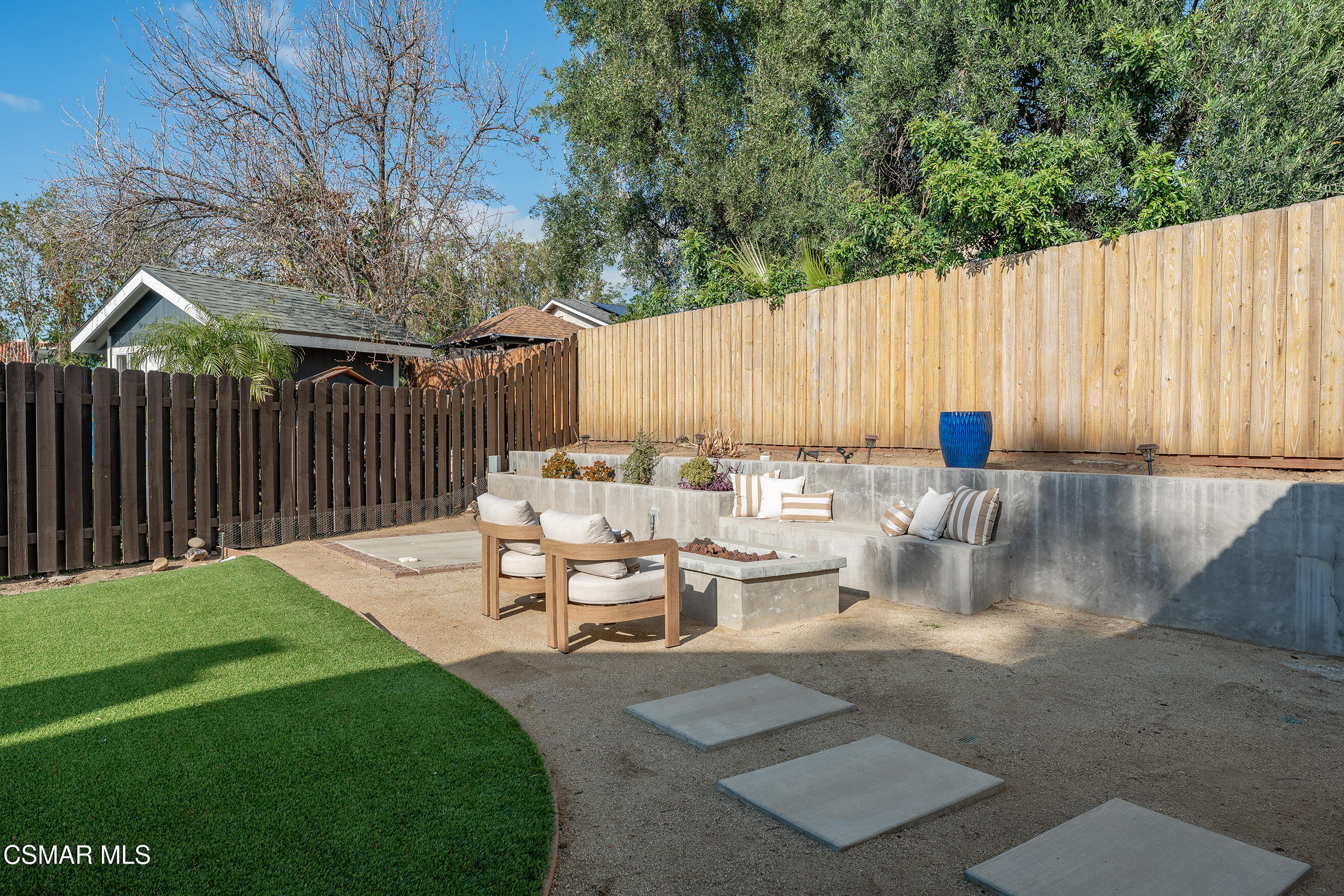 1860 Wychoff Avenue Simi Valley, CA 93063 - Photo 35 of 47 a view of a patio with table and chairs with wooden fence and plants