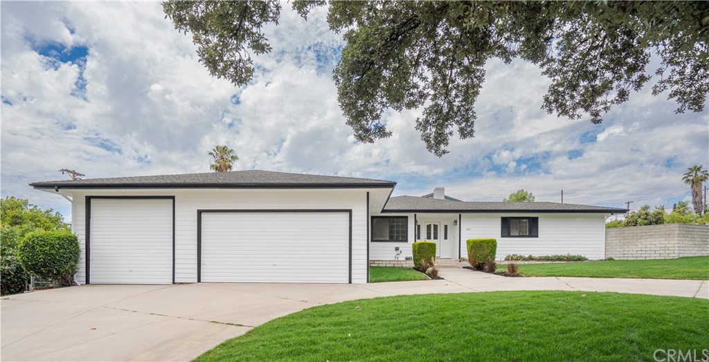front view of a house with a yard
