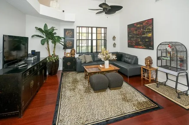 a living room with furniture and a flat screen tv