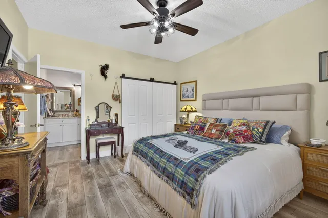 a bedroom with a bed and a table