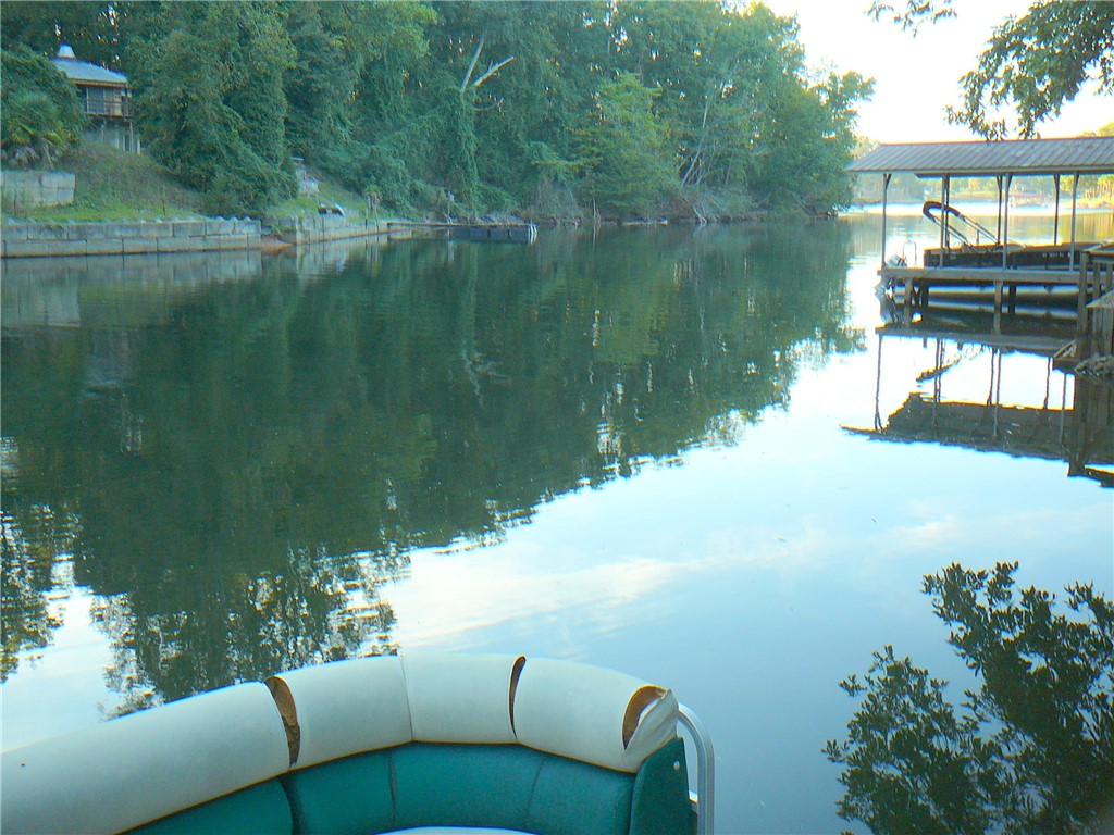 88 Catfish Cove Road Abbeville, SC 29620 - Photo 4 of 5 Quiet waterfront views expand past a private covered dock along the wooded shoreline.