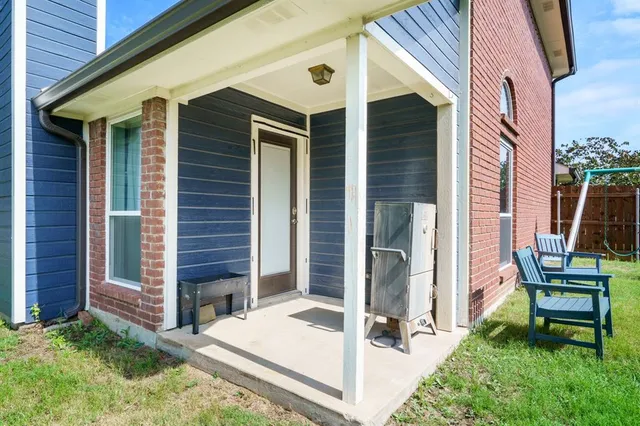 a front view of a house with a patio