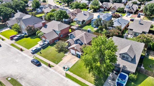 an aerial view of residential house with outdoor space and swimming pool