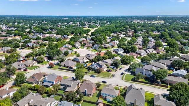 an aerial view of a city with lots of residential buildings