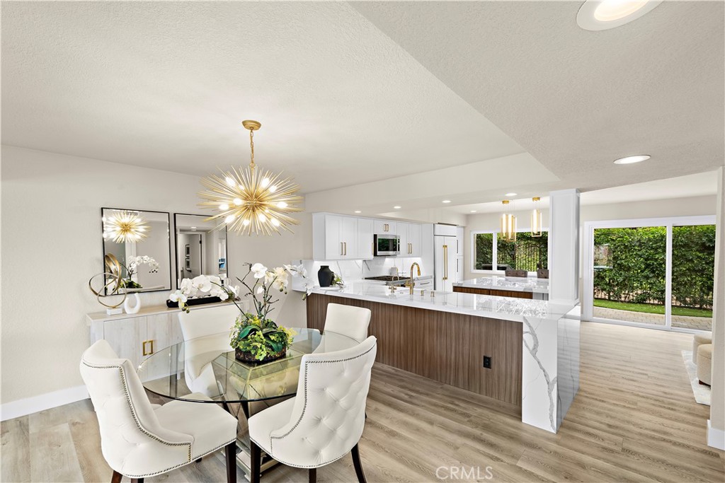 23277 Atlantis Way Dana Point, CA 92629 - Photo 12 of 48 a dining room with furniture a livingroom and chandelier
