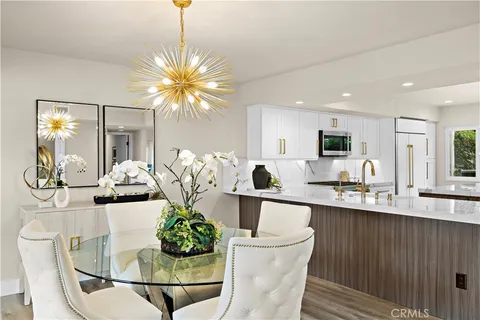 a kitchen with a table and chairs in it