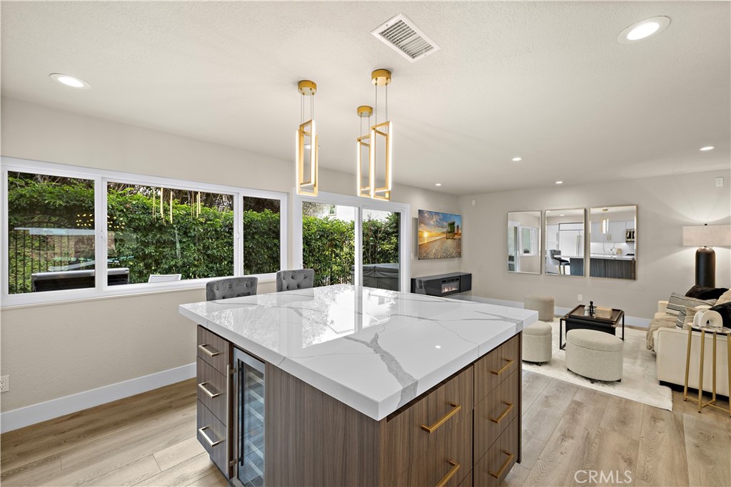 23277 Atlantis Way Dana Point, CA 92629 - Photo 18 of 48 a view of a living room and kitchen with a sink