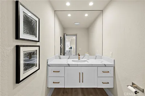 a bathroom with a sink a vanity and a mirror
