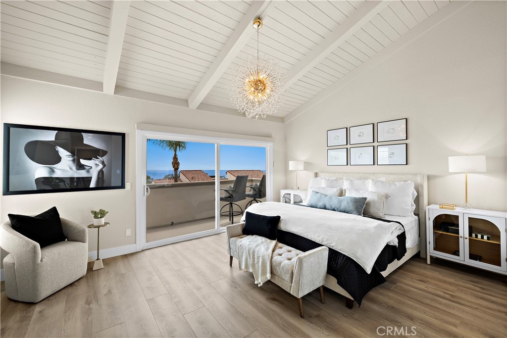 23277 Atlantis Way Dana Point, CA 92629 - Photo 23 of 48 a bedroom with a bed and glass walk in closet