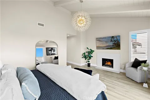 a bedroom with a bed and a fireplace