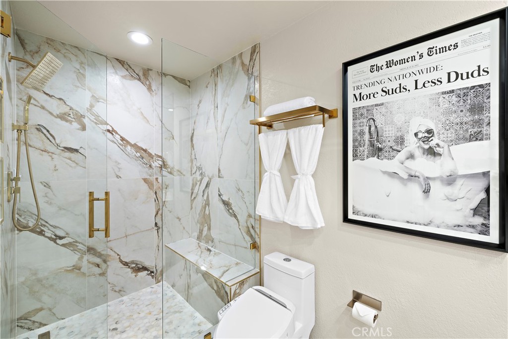 23277 Atlantis Way Dana Point, CA 92629 - Photo 28 of 48 a picture of a bathroom with a shower and a toilet