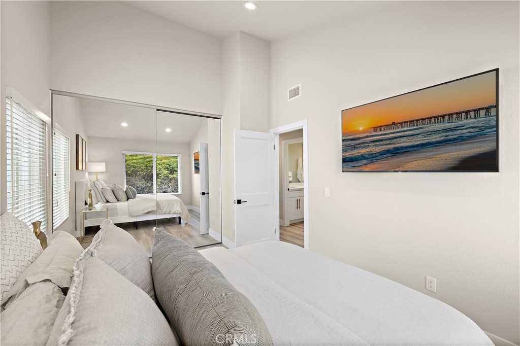 23277 Atlantis Way Dana Point, CA 92629 - Photo 30 of 48 a bedroom with a bed couch and large window