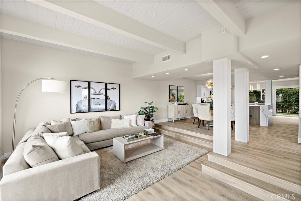 23277 Atlantis Way Dana Point, CA 92629 - Photo 3 of 48 a living room with furniture and a wooden floor