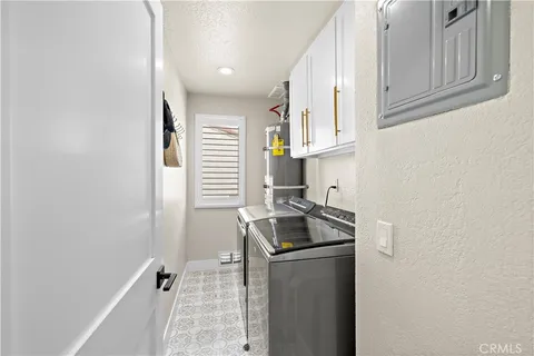 a kitchen with granite countertop cabinets stainless steel appliances and a sink