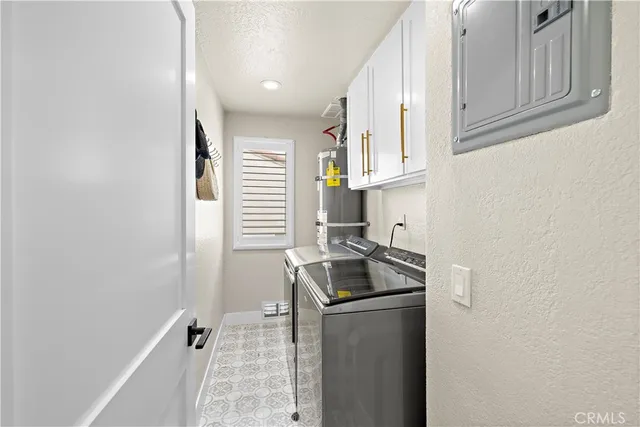 a kitchen with granite countertop cabinets stainless steel appliances and a sink