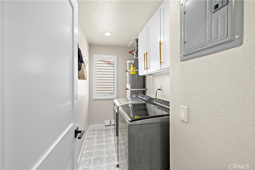 23277 Atlantis Way Dana Point, CA 92629 - Photo 33 of 48 a kitchen with granite countertop cabinets stainless steel appliances and a sink